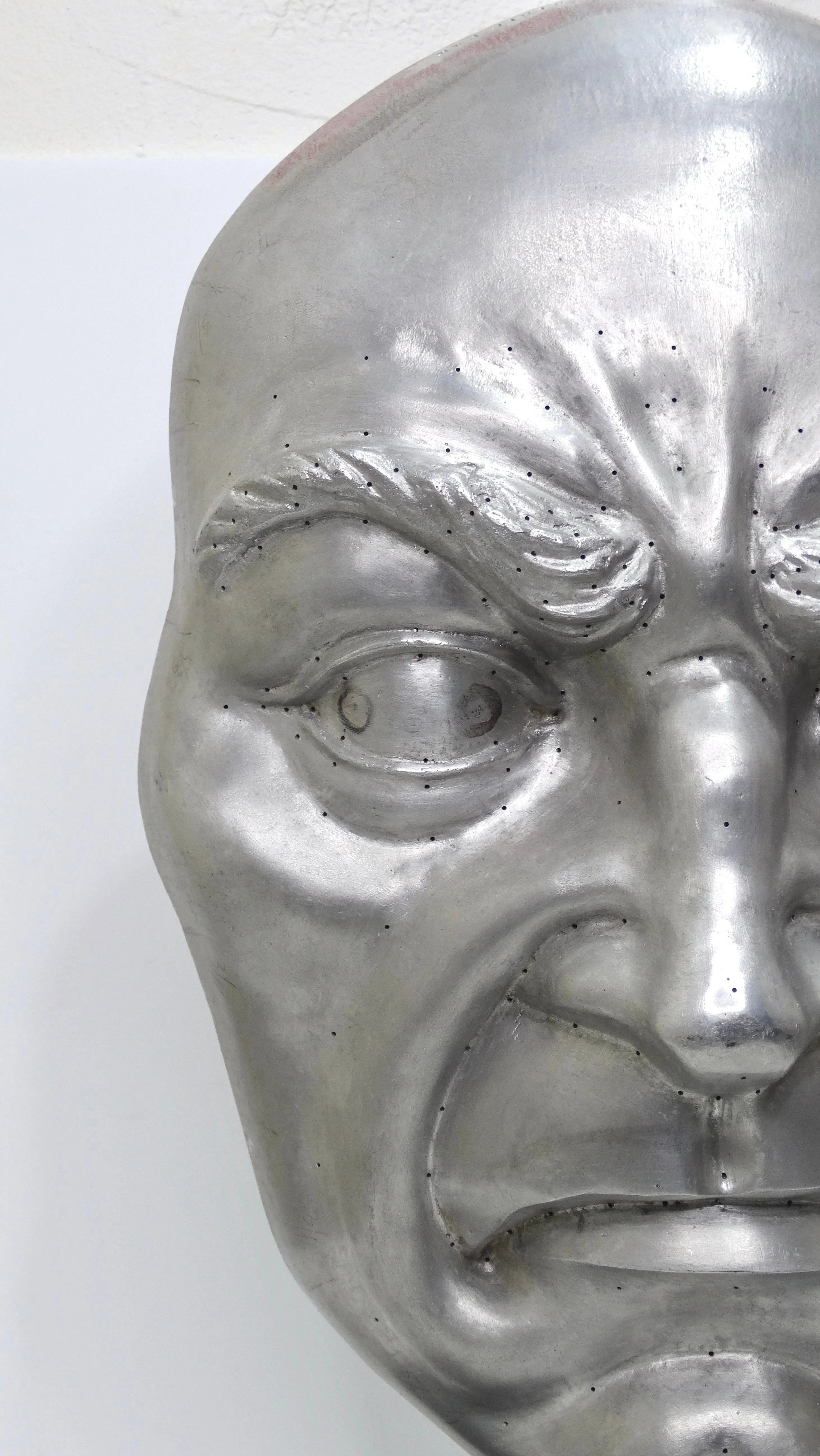 Metallic 'Angry Face' Sculpture