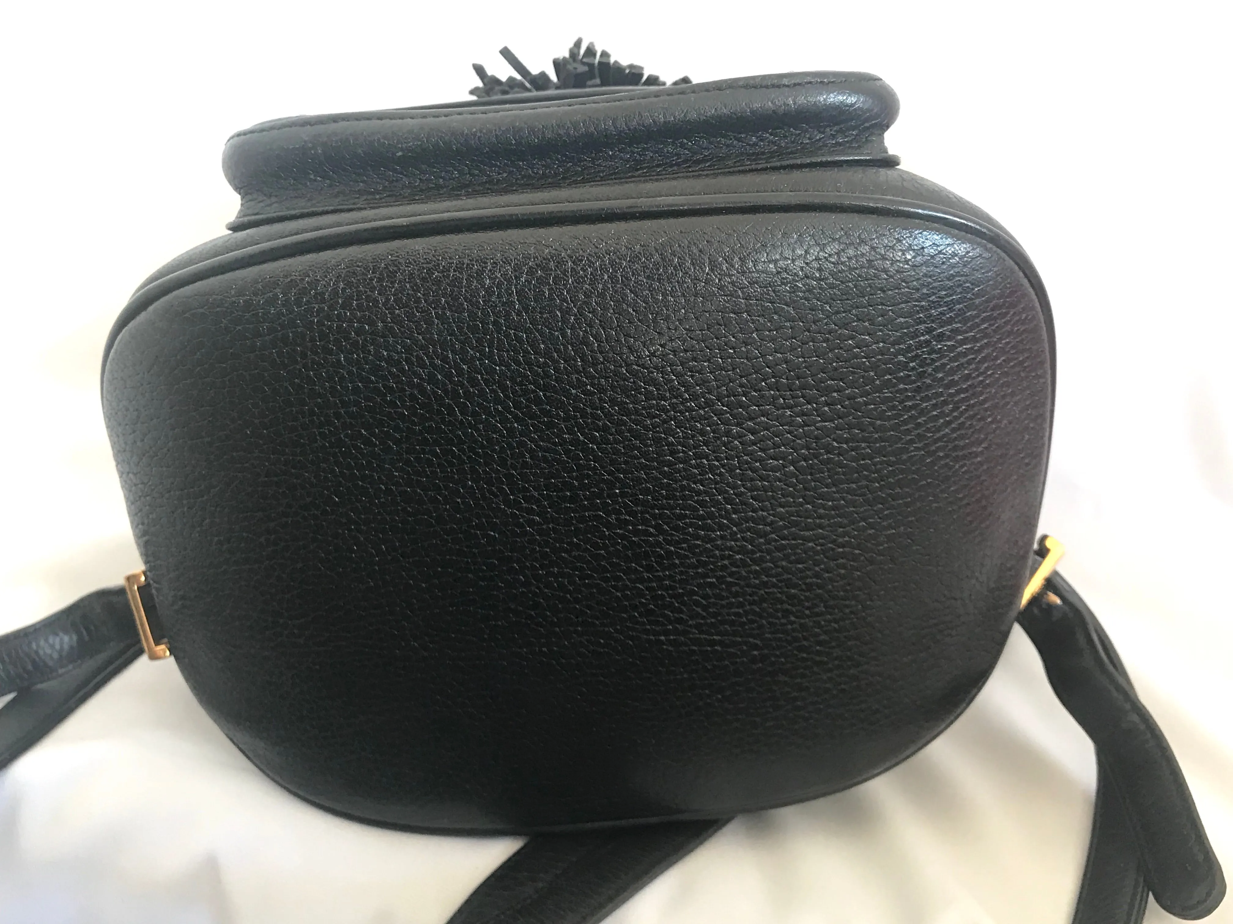 Vintage MCM black backpack with golden studded logo motifs and drawstrings. Designed by Michael Cromer. Unisex bag for daily use.