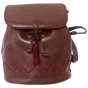 Vintage MOSCHINO genuine dark wine nappa leather backpack with tassel and logo embroidery motifs. Small to Medium size for daily use.